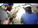 Rescuers pull man from rubble after Aleppo air strikes  - amateur video