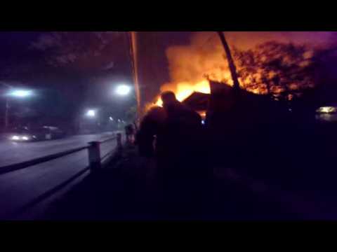 Dramatic footage shows moment Chilean police rescue elderly woman from burning house