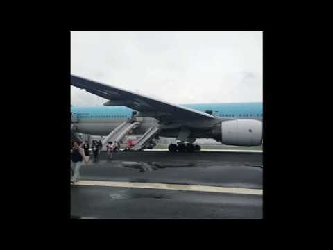 Passengers evacuate plane in Japan after engine smoke