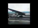 Passengers evacuate plane in Japan after engine smoke