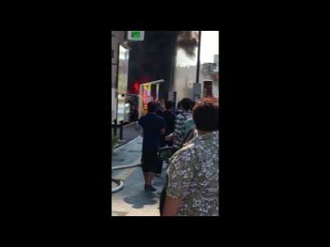 Amateur video shows vehicles on fire in the aftermath of a Japan suicide blast