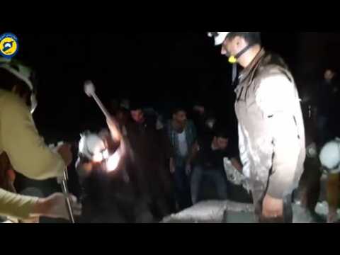 White Helmets show painstaking care to rescue buried Syrian boy - amateur video