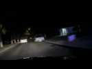 Police car comes under fire during pursuit of white Mazda.