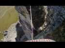 World champion rides bike over slackline in the Alps