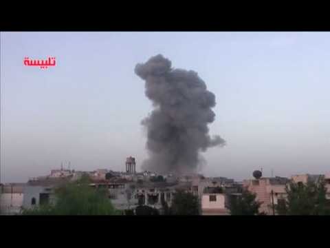 Syrian army and Russian jets target rebel towns north of Homs