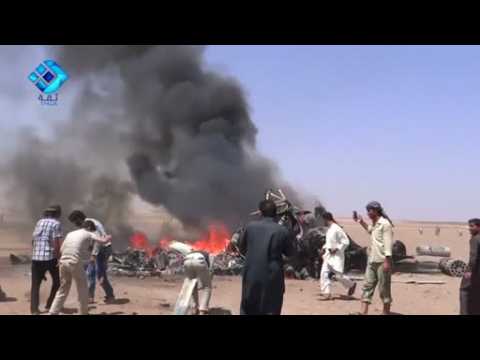 People gather around downed Russian helicopter in Syria - amateur video