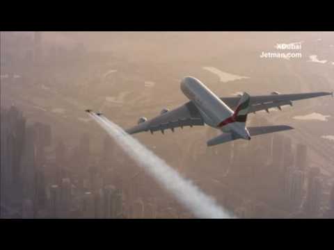 Daredevil couple fly in jet suits next to giant Airbus over Dubai