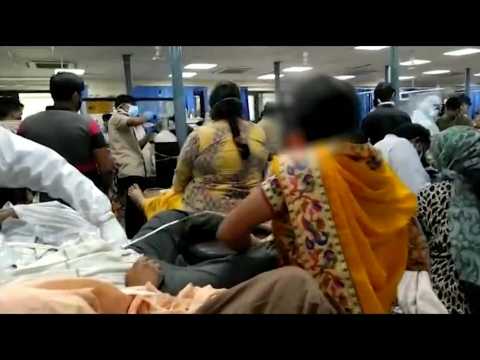 India's death toll hits new record as Covid 'tsunami' worsens: images inside crowded Delhi hospital