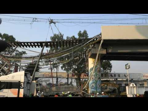 Workers continue to remove debris of collapsed metro line in Mexico City