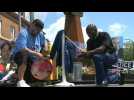 People take a knee at George Floyd memorial on anniversary of his death