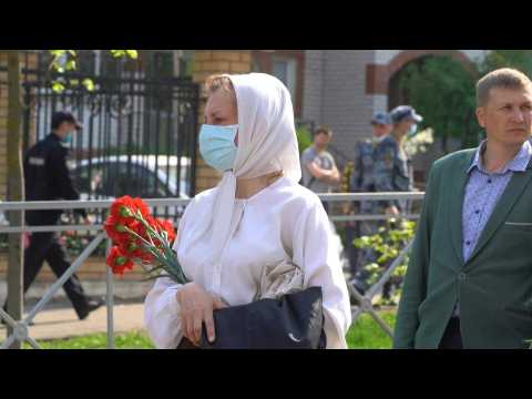 Russians in Kazan mark day of mourning after school shooting