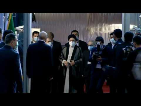 New Iranian president Raisi arrives to take oath before parliament