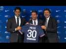 Football: Lionel Messi poses with new PSG shirt