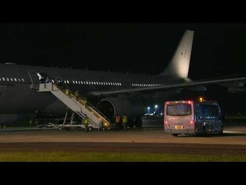 Evacuees from Afghanistan disembark from UK military plane in England