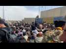Desperate Afghans wait outside Kabul airport in hope of leaving