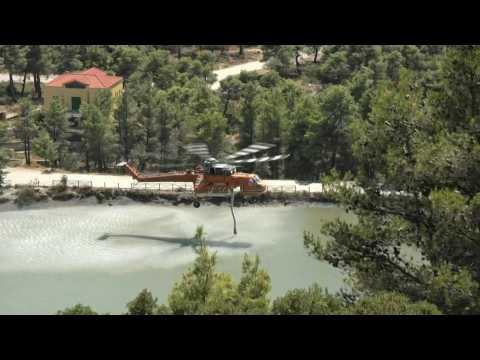 Firefighting helicopters battle blazes in Athens region