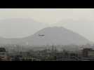 Airplanes land and take off at Kabul airport as evacuations continue