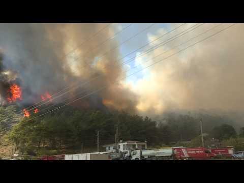 Turkish firefighters battle to extinguish blazes in resort town