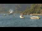 Boats come and go as people are to be evacuated from Turkey wildfires