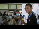 Tunisia's new Olympic king Ahmed Hafnaoui arrives in Tunis