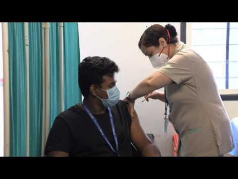 People receive vaccine as India administers a billion Covid jabs