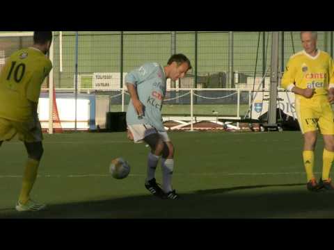 Emmanuel Macron scores penalty during charity football match