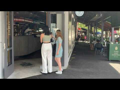 Images of Melbourne residents in a café after long Covid lockdown
