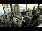 Emergency services clean up site of army bus bomb attack in Damascus