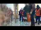 In Kazakhstan's largest city, workers clean up debris after violent clashes