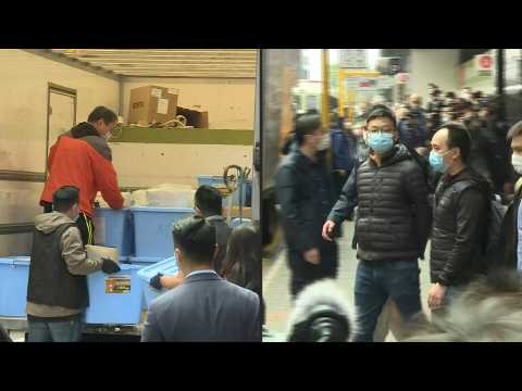 Hong Kong police take away evidence collected in local media raid