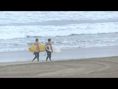 Surfers hit California beach despite US West Coast tsunami alert