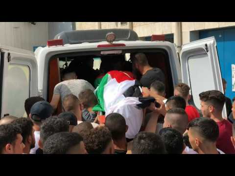 Mourners carry body of Palestinian teen killed by Israeli fire in WBank