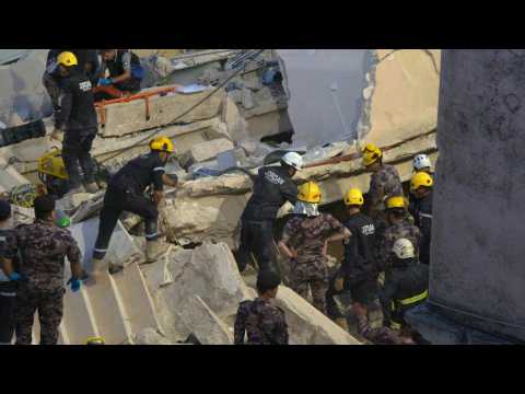 Rescuers search for survivors of Jordan building collapse