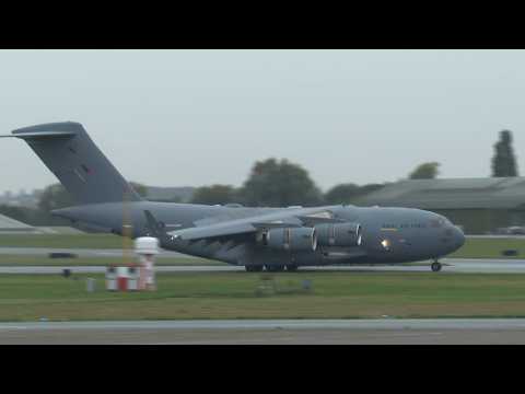 Plane carrying Queen Elizabeth II's coffin arrives in London