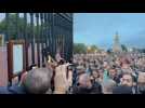 Large crowd outside Buckingham Palace as official notice of Queen Elizabeth's death is displayed