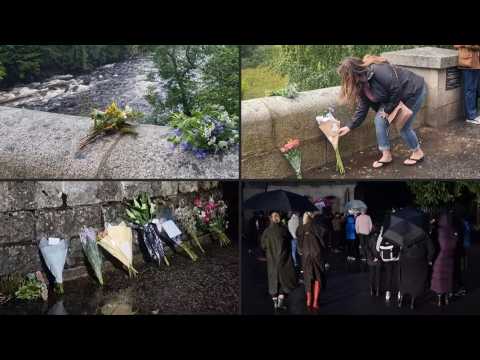 People lay flowers at Balmoral Castle following death of Queen Elizabeth II