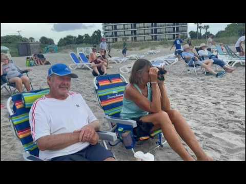 People wait eagerly for Artemis 1 launch at Cocoa Beach, Florida