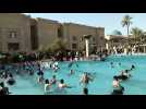 Iraq's Sadr supporters cool off in Baghdad government building pool