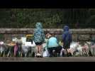 People lay flowers in front of Balmoral Castle after Elizabeth II's death