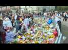 People place flowers for Queen Elizabeth II in Windsor