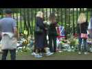 People lay flowers at Windsor Castle for Queen Elizabeth II