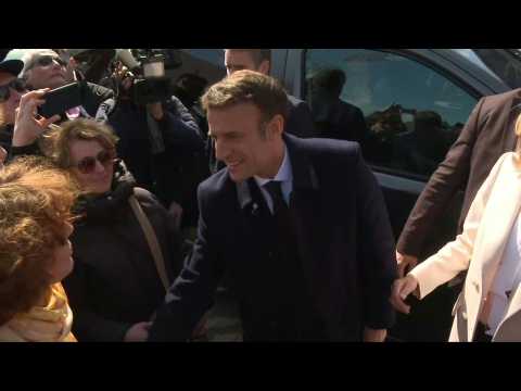 Macron, wife Brigitte leave to vote in first round of presidential election