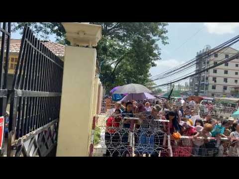 People wait outside prison after Myanmar's junta says will free 1,600 prisoners