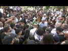 People gather at Mt Zion cemetery where slain Al Jazeera journalist is laid to rest