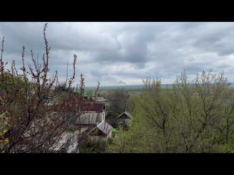 Smoke billows above the town of Rubizhne, recently taken by Russian forces