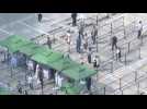 Beijing residents queue for Covid tests as city seals off neighbourhoods
