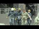 A body is retrieved from the Kyiv building hit by a Russian strike