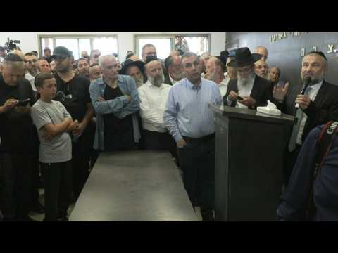 Mourners pay their respects during funeral of Israeli killed in Palestinian attack
