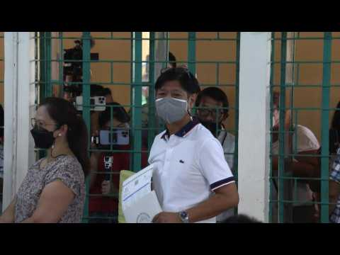 Philippine presidential frontrunner Marcos Jr votes in his hometown