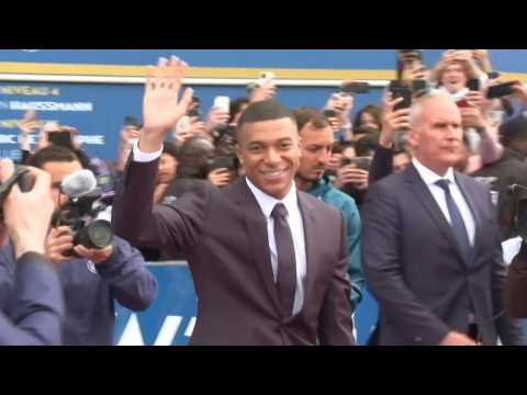 Kylian Mbappe greets fans outside the Parc des Princes stadium
